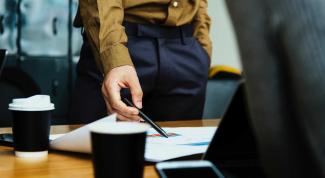 Business person standing during a meeting